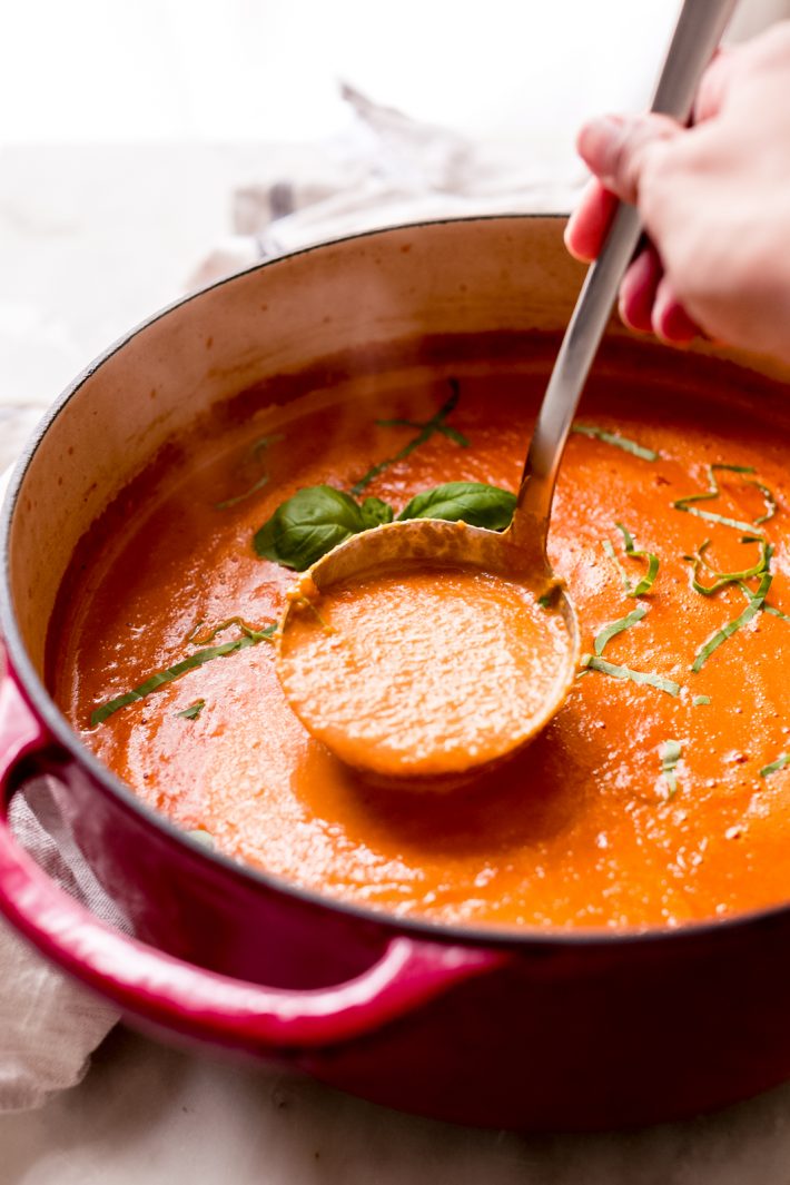 Secret Ingredient Tomato Basil Soup - the best tomato basil soup you'll even have and it has zero cream! #tomatobasilsoup #tomatosoup #dairyfree #roastedtomatosoup #soup #lunch | Littlespicejar.com