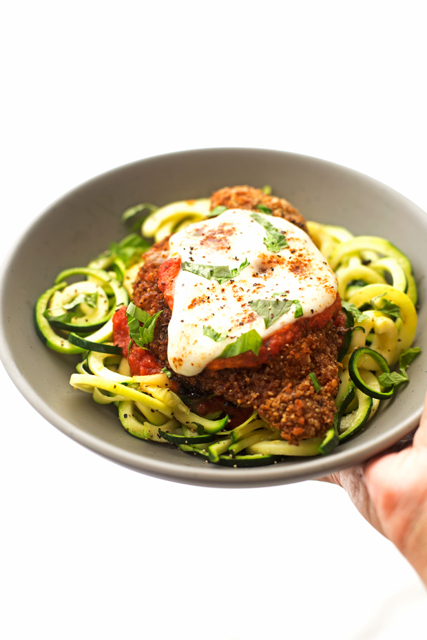Walnut Crusted Healthy Chicken Parmesan with Zoodles - A healthier take on the chicken parm - we're using walnuts to coat the chicken so it's healthier but still has that crunch! #healthychickenparmesan #walnutcrustedchicken #bakedchicken #chickenparmesan | Littlespicejar.com