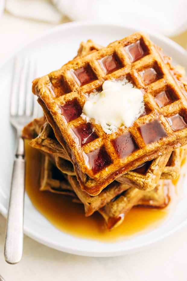 Buttermilk Pumpkin Waffles - The more tender and fluffy waffles that are spiced with fall flavors! Drizzled with maple syrup, they're perfect for fall breakfast! #waffles #pumpkinwaffles #buttermilkwaffles | Littlespicejar.com