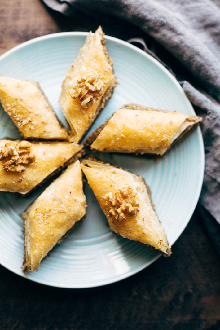 Holiday Walnut Baklava - buttery phyllo with layers of ground walnuts in between and drizzled with a homemade simple syrup with sweet orange blossom and rose water! So good! #baklava #walnutbaklava #lebanesebaklava | Littlespicejar.com