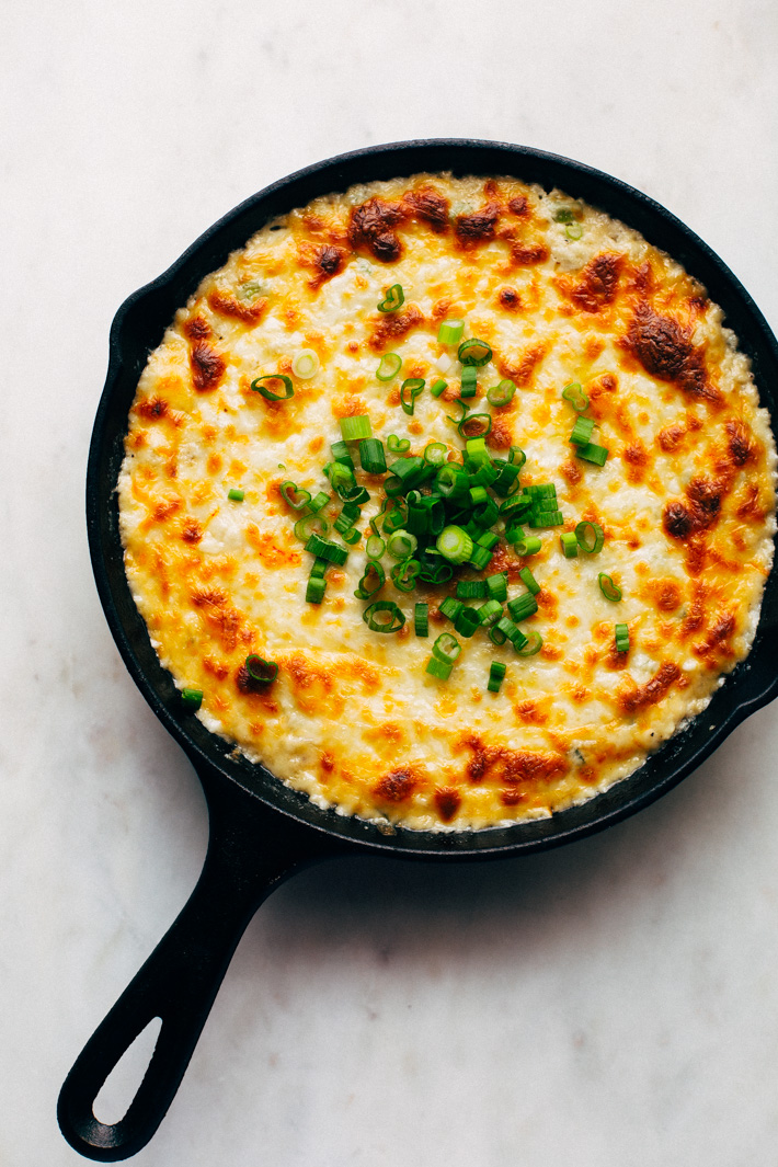 Bubbly Hot Crab Dip - this hot crab dip tastes just like crab rangoon puffs! It's easy to make and takes about 30 minutes and is perfect for NYE parties, christmas, or super bowl sunday! #hotcrabdip #crabdip #crabrangoondip #dip | Littlespicejar.com