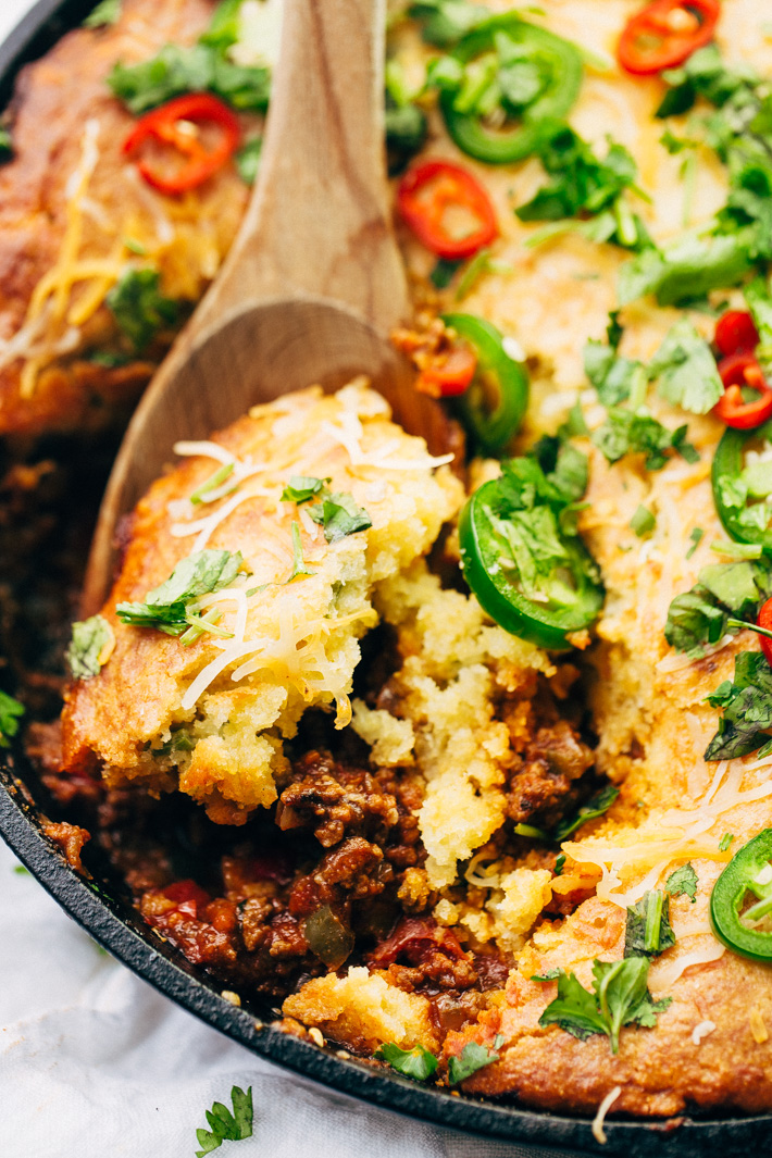 Skillet Chili with Jalapeño Cheddar Cornbread Crust - A simple chili and cornbread recipe that takes comes together in one pan and is so hearty and filling! #cornbread #chili #skilletchili #comfortfood | Littlespicejar.com