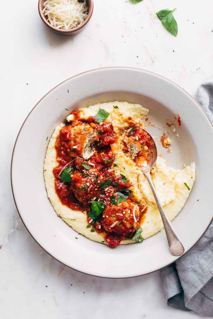 Chicken Parmesan Meatballs and Creamy Polenta - a perfect dish for date night in! These meatballs are flavorful and tender! Serve over parmesan polenta or spaghetti! #chickenparmesan #chickenparmesanmeatballs #polenta #chickenmeatballs #meatballs | Littlespicejar.com