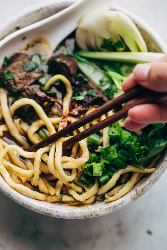 Comfy Cozy Taiwanese Beef Noodle Soup - thick and chewy noodles in a homemade. slow simmered broth with tons of tender beef and fresh greens! #beefnoodlesoup #beefsoup #taiwanesebeefnoodlesoup #asiannoodlesoup | Littlespicejar.com