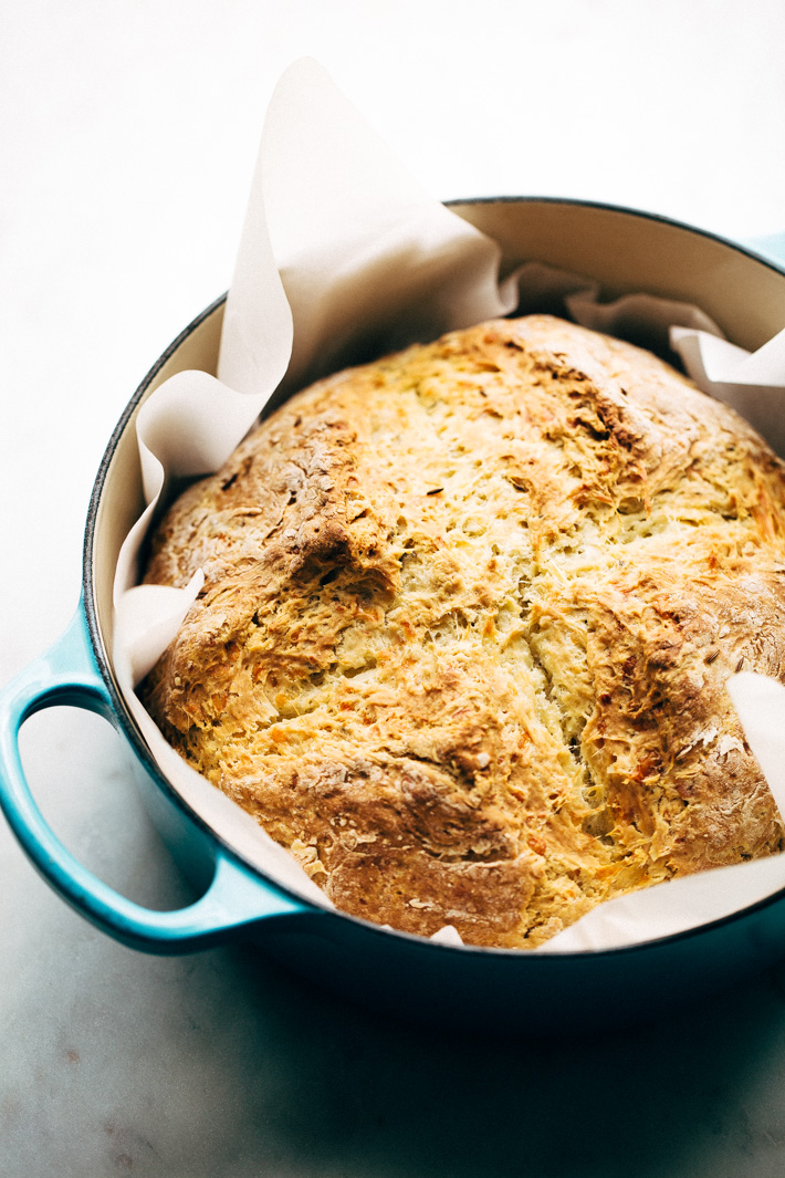 Easy Caraway and Cheddar Irish Soda Bread - bread made with just a few ingredients! Ready in less than an hour and speckled with caraway seeds and cheddar cheese! #irishbread #sodabread #irishsodabread #quickbread #nokneadbread | Littlespicejar.com