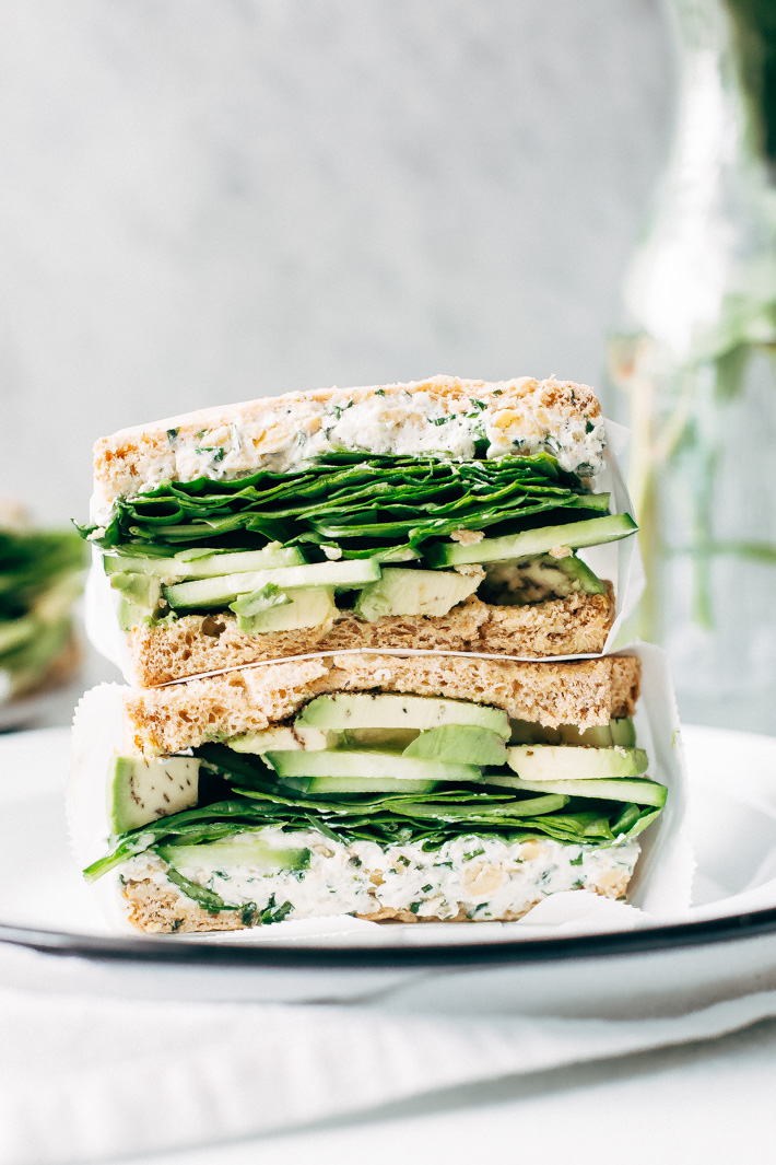 Smashed Chickpea Green Goddess Sandwich - herbed goat cheese and smashed chickpeas loaded between two slices of bread with all your favorite green veggies. This is the perfect lunch! #greengoddesssandwich #sandwich #smashedchickpea #chickpeas | Littlespicejar.com