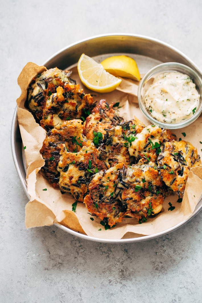 Cheesy Wild Rice Chicken Fritters - the perfect two-bite appetizers for holiday get togethers. Make them larger and serve them between buns or on a salad too! #appetizers #chickenfritters #fritters #holidayappetizers | Littlespicejar.com
