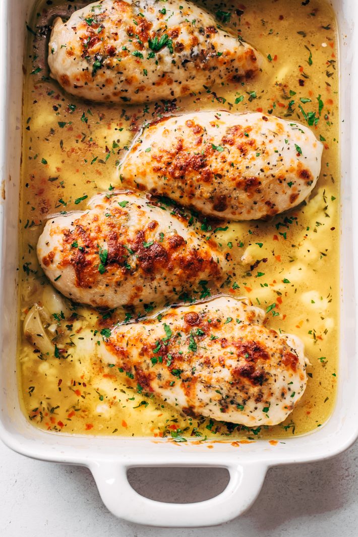 Baked Garlic Butter Chicken with Mozzarella - learn how to bake chicken breasts in a simple garlic butter sauce. Serve with just about anything you like! #garlicbutterchicken #bakedchicken #garlicbutterbakedchicken #chickenrecipes | Littlespicejar.com