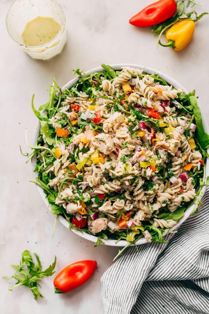 Quick Summer Tuna Pasta Salad - Learn how to make a quick summer tuna pasta salad that comes together in a flash! Loaded with tons of tender, peppery arugula, flakey tuna, and zesty pepperoncini. Dress it with the most addicting lemon ranch dressing. This is sure to become a go-to summer lunch recipe! #tunasalad #tunapastasalad #pastasalad #mealprep #healthylunch #saladrecipe | Littlespicejar.com