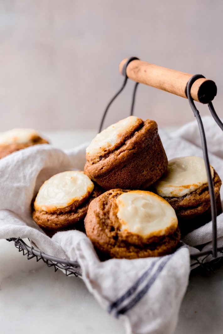 Spiced Chai Pumpkin Cheesecake Muffins - these are pumpkin muffins stuffed and topped with cheesecake batter! They're the perfect balance of sweet so they're perfect with a warm cup of coffee in the morning! #pumpkinmuffins #chai #pumpkincheesecakemuffins #spicedpumpkinmuffins #baking | Littlespicejar.com