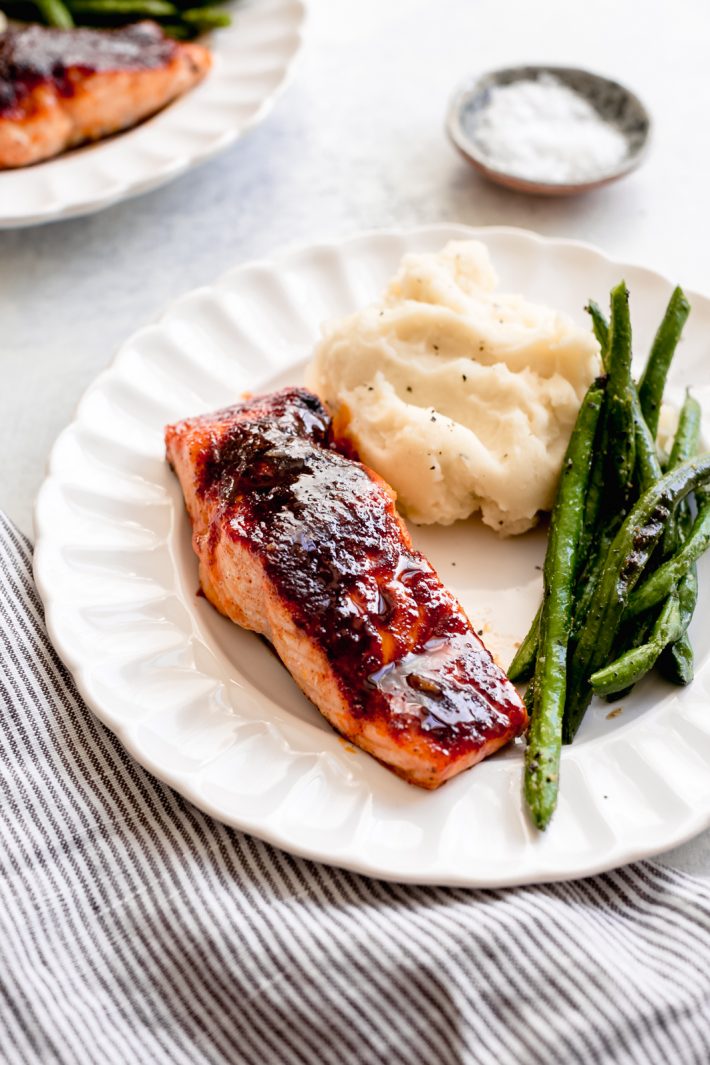 Spicy Maple Glazed Salmon - just a handful of ingredients is all you need to make this simple sweet yet spicy salmon recipe! Ready in 15 minutes! #bakedsalmon #glazedsalmon #roastedsalmon #salmonrecipe #easydinnerrecipe | Littlespicejar.com