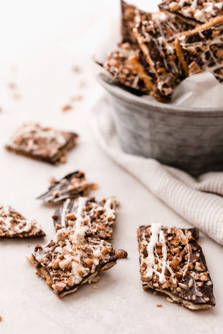 Addicting Christmas Crack (Saltine Toffee Bark) - Learn how to make a grown up version of the famous saltine toffee! I like to use ingredients that help cut through some of that sweetness. Guaranteed to be addicting! #saltinetoffee #saltinetoffeebark #christmasfood #christmascrack #holiday #toffeebark | Littlespicejar.com