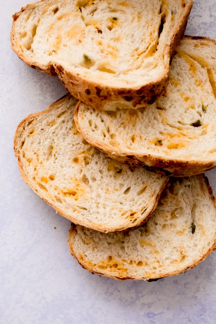 Homemade Jalapeño Cheddar Bread - learn how to turn everyday sandwich bread into something amazing! Use this to make grilled cheese sandwiches, serve with chili, or tomato soup, or make gourmet sandwiches! #cheddarcheesebread #cheesebread #jalapenocheddarbread #sandwichbread #breadrecipe | Littlespicejar.com