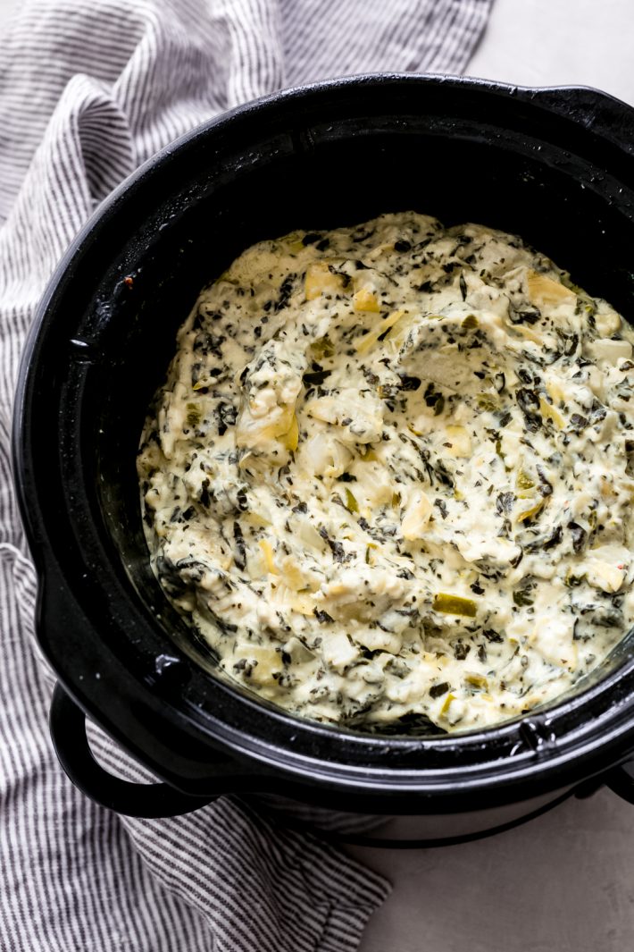 The Easiest Slow Cooker Spinach Artichoke Dip - Learn how to make the easiest dip EVER! Just toss everything into a slow cooker and let it do the work for you! #spinachartichokedip #hotspinachdip #hotdip #hotartichokedip #slowcookerspinachdip #slowcookerspinachartichokedip | Littlespicejar.com