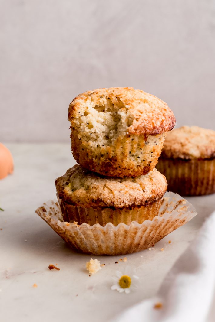 Warm Lemon Zucchini Muffins - these muffins are tender as can be and loaded with spices and zucchini. So good you'll never make any other zucchini muffin recipe again! #zucchinimuffins #lemonzucchinimuffins #lemonpoppyseedmuffins #muffins #baking | Littlespicejar.com
