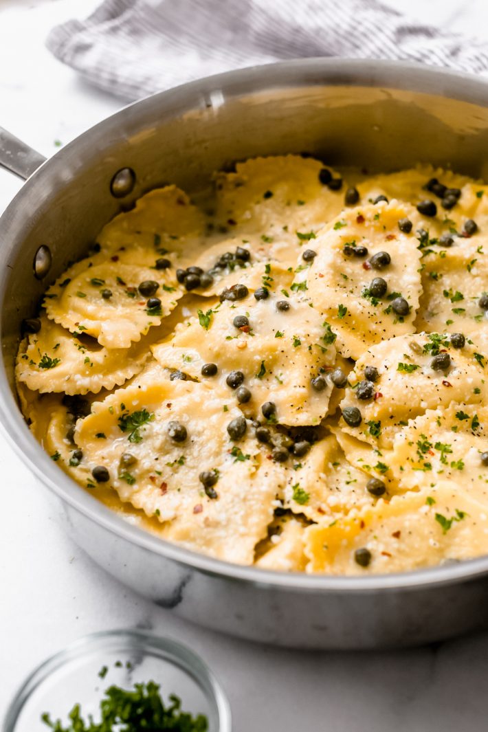Super Easy Weeknight Ravioli Piccata - skip the sautéd chicken and go straight for the ravioli! It's your favorite ravioli tossed in my homemade lemon butter and caper sauce and it is so quick and easy to make! #piccata #chickenpiccata #ravioli #homemaderavioli #raviolipiccata | Littlespicejar.com