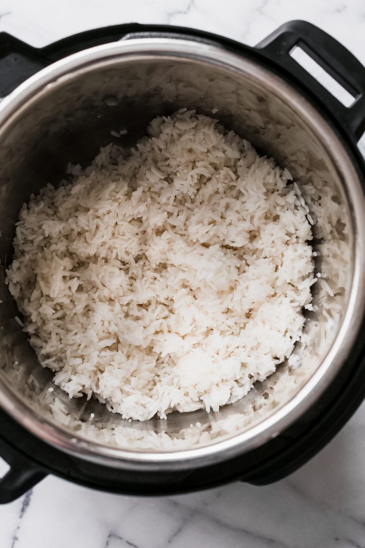 5 Ingredient Instant Pot Coconut Rice - Learn how to make coconut rice in the instant pot. A simple recipe that takes about 5 minutes to toss together and goes with so many different types of cuisines! #instantpot #instantpotrecipes #instantpotcoconutrice #coconutrice #jasminerice #jasminecoconutrice | Littlespicejar.com