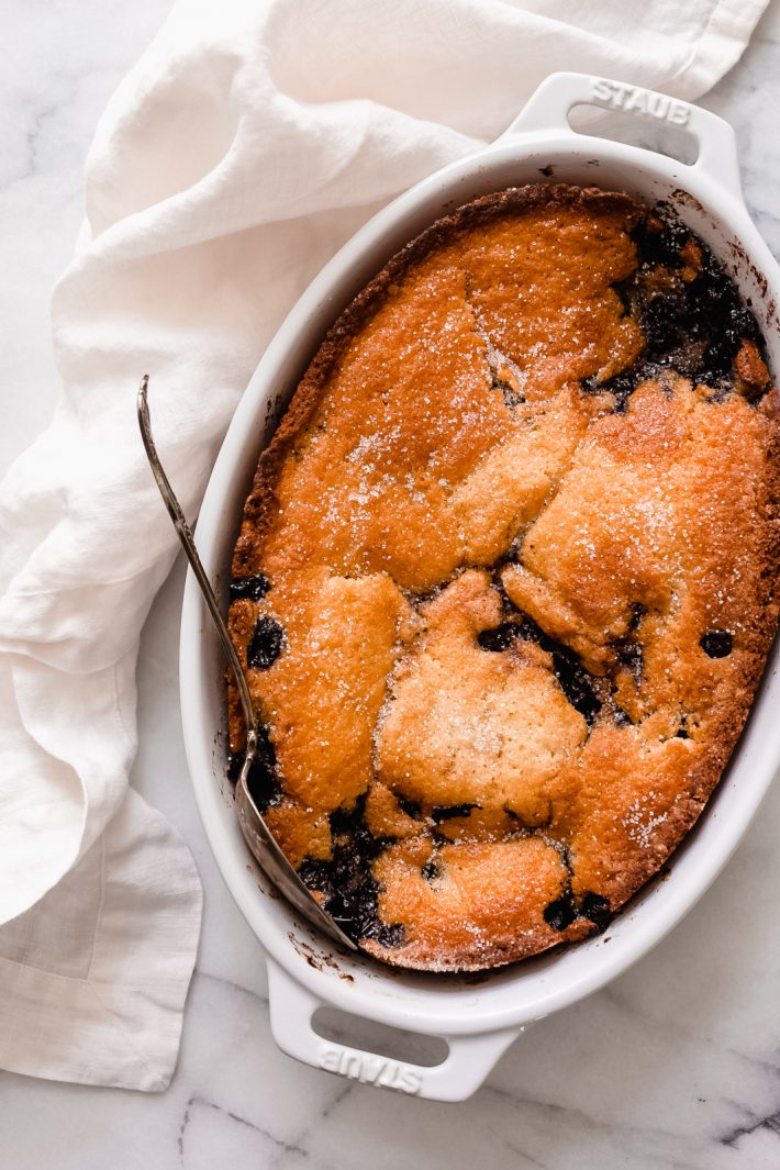 Easy Texas Blueberry Cobbler - Learn how to make the easiest blueberry cobbler that takes just 10 minutes to prep and you only need 10 ingredients! #easydesserts #cobbler #easycobbler #dessert #dessertrecipe #easterdesserts #warmdesserts #blueberrycobbler #texascobbler | Littlespicejar.com