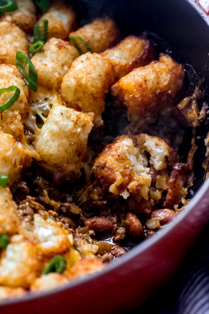 Tater Tot Chili Cheese Hotdish - A homemade chili with beans, topped with shredded cheese and tater tots and it all comes together in ONE pot! #chilicheesehotdish #hotdish #onepotmeals #recipes #dinnerrecipes #easyrecipes | Littlespicejar.com