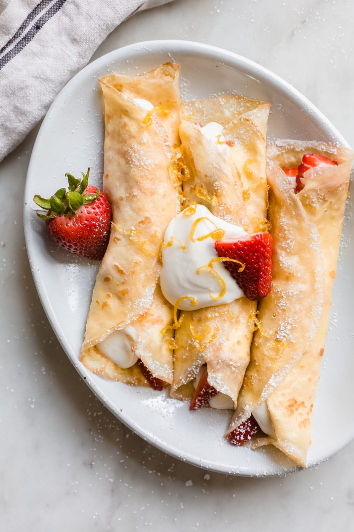 Easy Blender Crepes - Learn how to make crepe batter in the blender! You can make them savory or sweet! Stuff with ice cream, berries, whipped cream, or savory fillings! #crepes #easycrepes #blendercrepes #brunch #mothersday #brunchrecipes | Littlespicejar.com