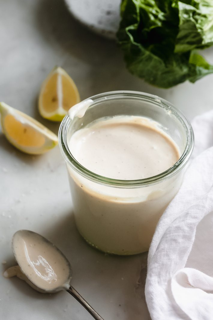 2-Minute Creamy Caesar salad Dressing - learn how to make the easiest, tastiest Caesar salad dressing at home! Just toss it all in a blender and give it a whiz! #caesarsalad #caesardressing #caesarsaladdressing #homemadedressing | Littlespicejar.com