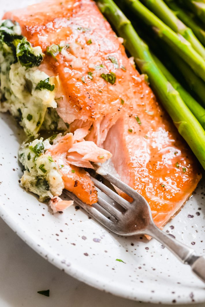 Creamy Spinach Artichoke Stuffed Salmon with Lemon Butter Sauce - An easy yet fancy dinner that's quick enough to prepare for weeknights and fancy enough to serve company! The lemon butter sauce is truly to-die-for! #stuffedsalmon #searedsalmon #salmonrecipes #ketorecipes #keto #ketodinner #salmonrecipes | Littlespicejar.com