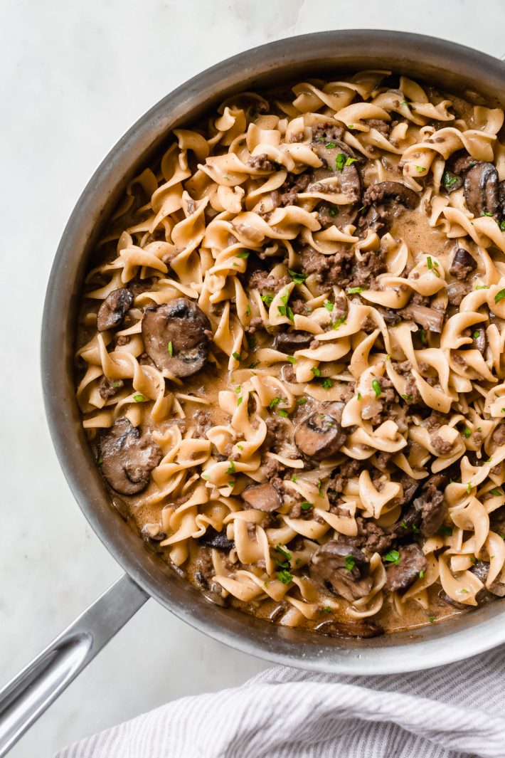 30-Minute Skillet Ground Beef Stroganoff - loaded with lots of flavor, this ground beef stroganoff is ready in 30 minutes and is sure to be a crowd pleaser! #stroganoff #onepotstroganoff #skilletstroganoff #groundbeefstroganoff #onepot #onepan #dinner | Littlespicejar.com