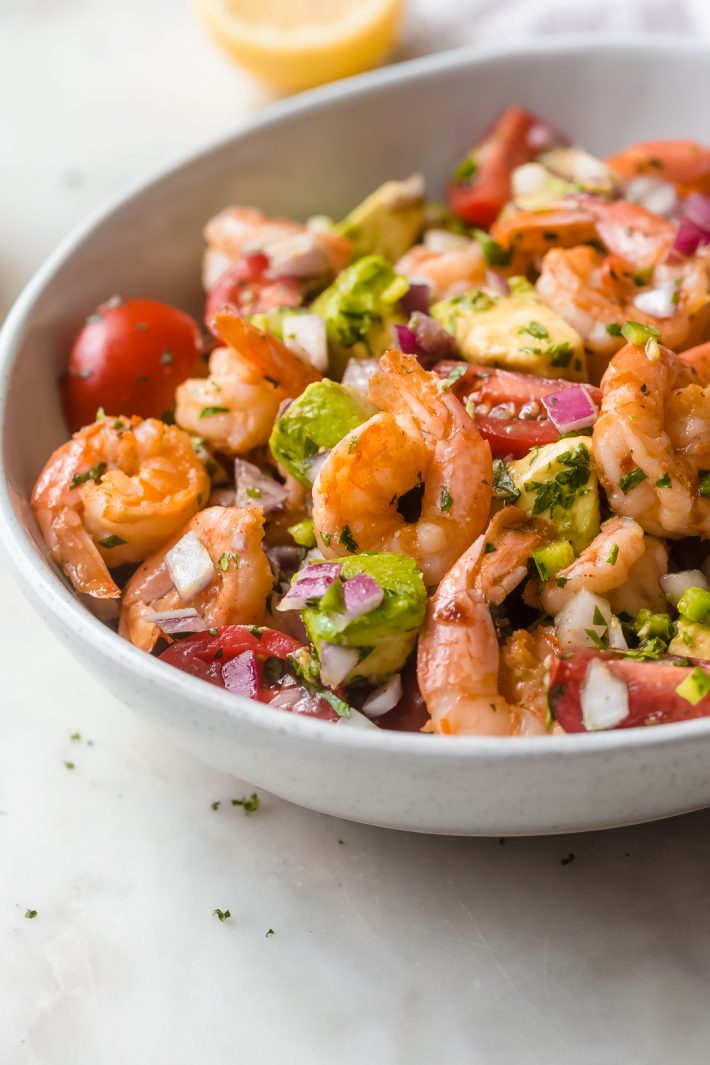 Mexican Shrimp Salad - Just 15 minutes to prepare from start to finish! Loaded with buttery avocados, tomatoes, sautéed shrimp, and a refreshing dressing! #shrimpsalad #mexicanshrimpsalad #shrimpavocadosalad #salad #dinnerrecipes #shrimprecipes | Littlespicejar.com
