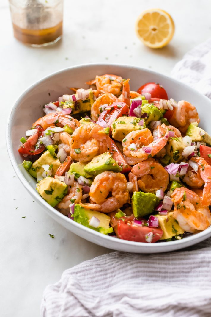 Mexican Shrimp Salad - Just 15 minutes to prepare from start to finish! Loaded with buttery avocados, tomatoes, sautéed shrimp, and a refreshing dressing! #shrimpsalad #mexicanshrimpsalad #shrimpavocadosalad #salad #dinnerrecipes #shrimprecipes | Littlespicejar.com