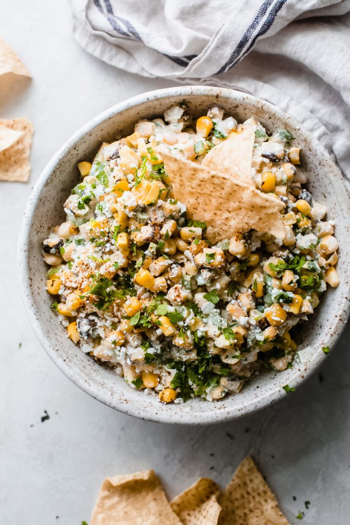 Creamy Mexican Street Corn Dip (Elotes Dip) - The easiest creamy Mexican corn dip! Elotes dip is basically a Mexican-style creamy corn dip. Ready in 10 minutes and perfect for barbecues and potlucks! #elotesdip #corndip #creamcorndip #mexicanstreetcorndip #potluckrecipes #barbecuerecipes #diprecipes | Littlespicejar.com