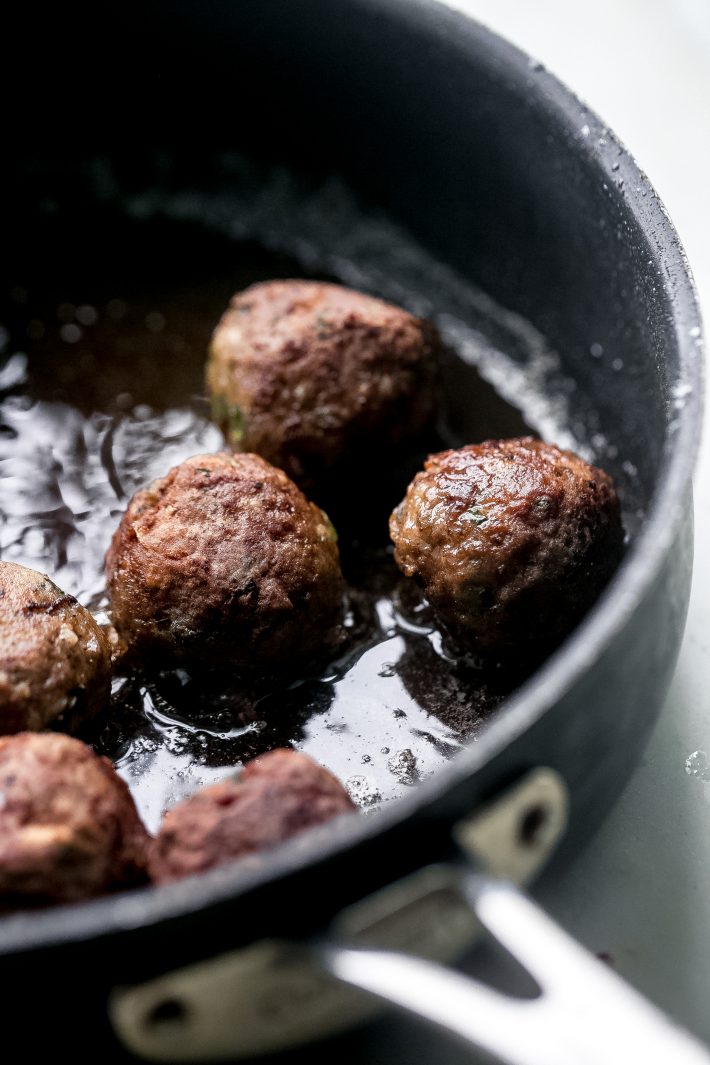 Greek Meatballs (Keftedes) - Learn how to make Greek Meatballs or Keftedes. These meatballs are scented with spices, loaded with grated onions and garlic and fresh parsley, so they’re flavorful and perfect to stuff inside pitas and top with tzatziki! #keftedes #greekmeatballs #meatballs #pitawraps #mezzeplatter | Littlespicejar.com