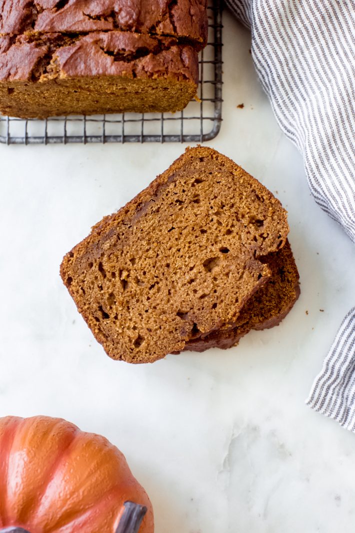 Spiced Brown Butter Pumpkin Bread - an easy recipe for pumpkin bread loaded with a toffee scent and all the fall spices! My recipe uses an entire can of pumpkin puree, leaving you with an uber tender loaf! #pumkinbread #brownbutter #pumpkinloaf #thanksgivingrecipes #pumpkinbreadrecipe | Littlespicejar.com