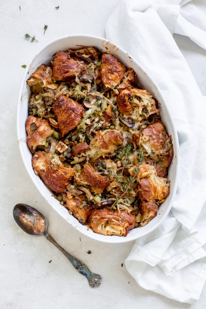 Savory Caramelized Onion Croissant Stuffing - made with buttery croissants, caramelized onions, and all the aromatics this croissant stuffing is sure to be a hit at the Thanksgiving or Christmas table! #croissantstuffing #homemadestuffing #thanksgivingrecipes #stuffingrecipe #beststuffingrecipe | Littlespicejar.com