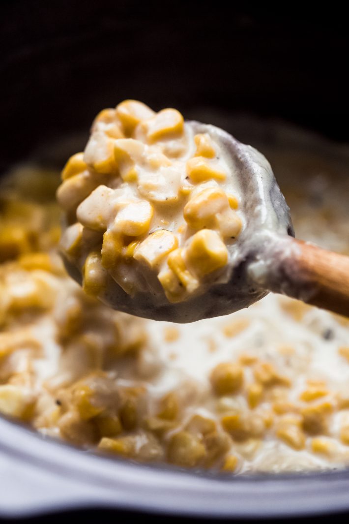 Slow cooker creamed corn is the perfect side dish for the Thanksgiving table! Made with sweet tender kernels of corn, in a velvety smooth parmesan cream sauce. It comes together in a slow cooker and you can customize it however you like! #creamedcorn #thanksgiving #sidedishes #slowcookercreamedcorn #easysides #christmas | Littlespicejar.com