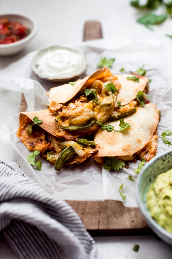 baked chicken quesadillas on a cutting board