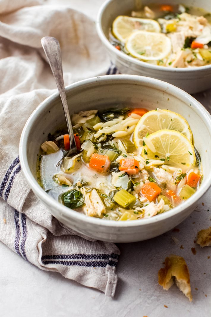 Herb-Loaded Lemon Chicken Orzo Soup - A hearty yet light herb-loaded lemon chicken orzo soup that is sure warm you right up! This soup is cozy and comforting and perfect, especially if you’re feeling under the weather! #chickensoup #souprecipes #soup #chickennoodlesouprecipe | Littlespicejar.com