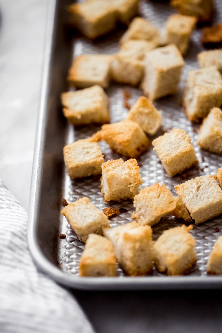 Toasted bread cubes on sheet pan