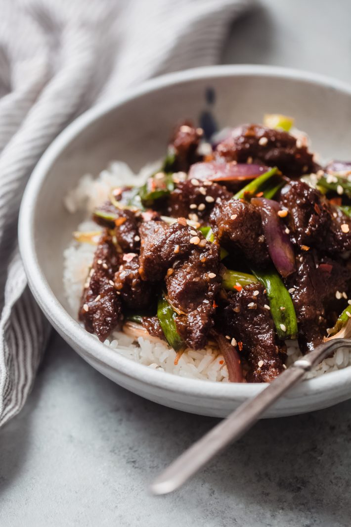 close up of jasmine rice with Mongolian Beef on top