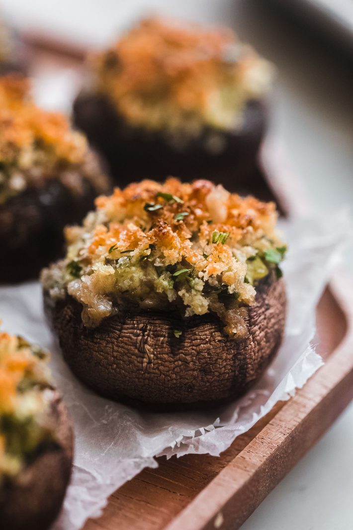 spinach and cheese stuffed mushrooms on serving dish