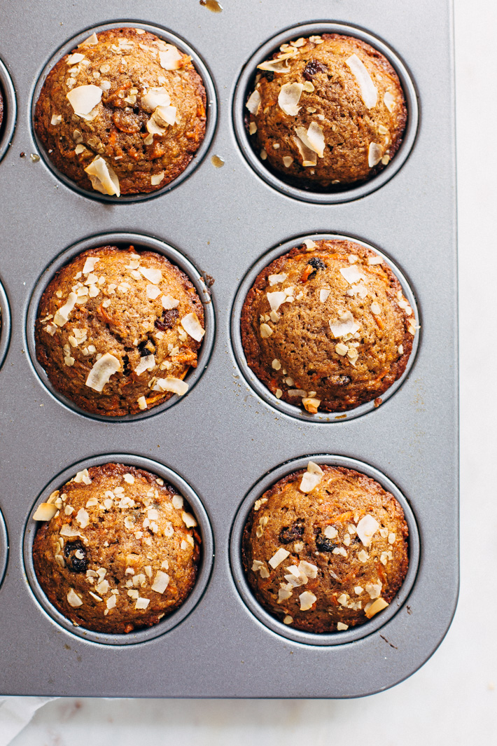 Super Moist and Healthy Carrot Cake Muffins - Made with less sugar than traditional muffins and packed with greek yogurt and apple sauce so there isn't a dry crumb in sight! #carrotcake #carrotcakemuffins #muffins #healthy | Littlespicejar.com