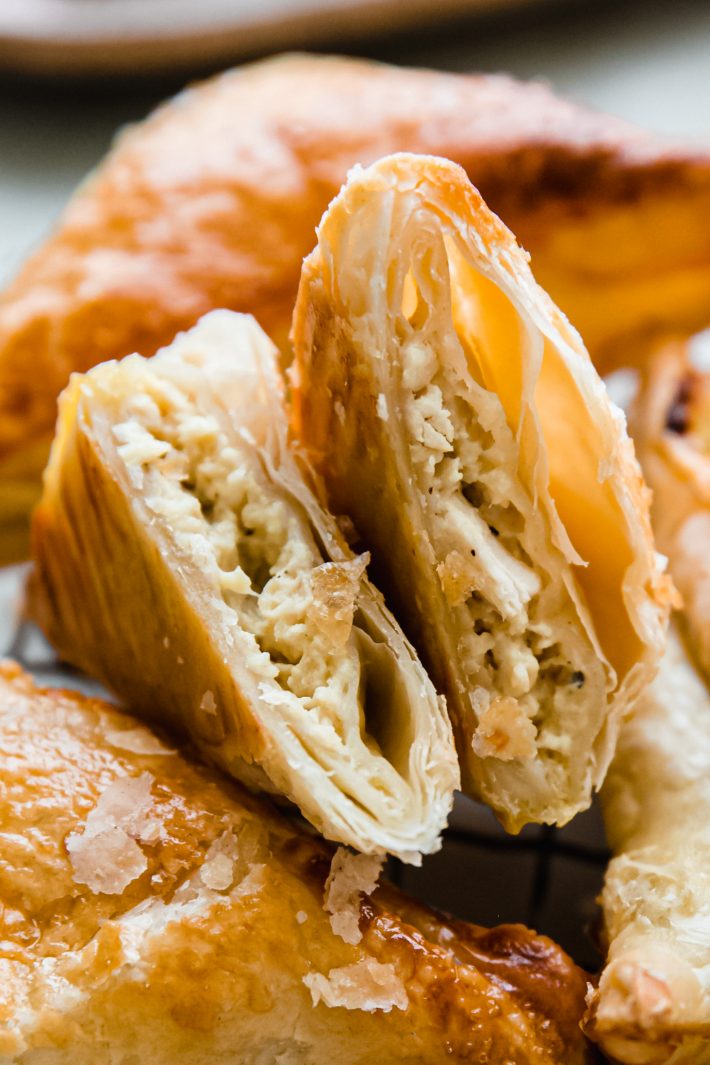 cut open chicken puff pastry showing creamy chicken filling