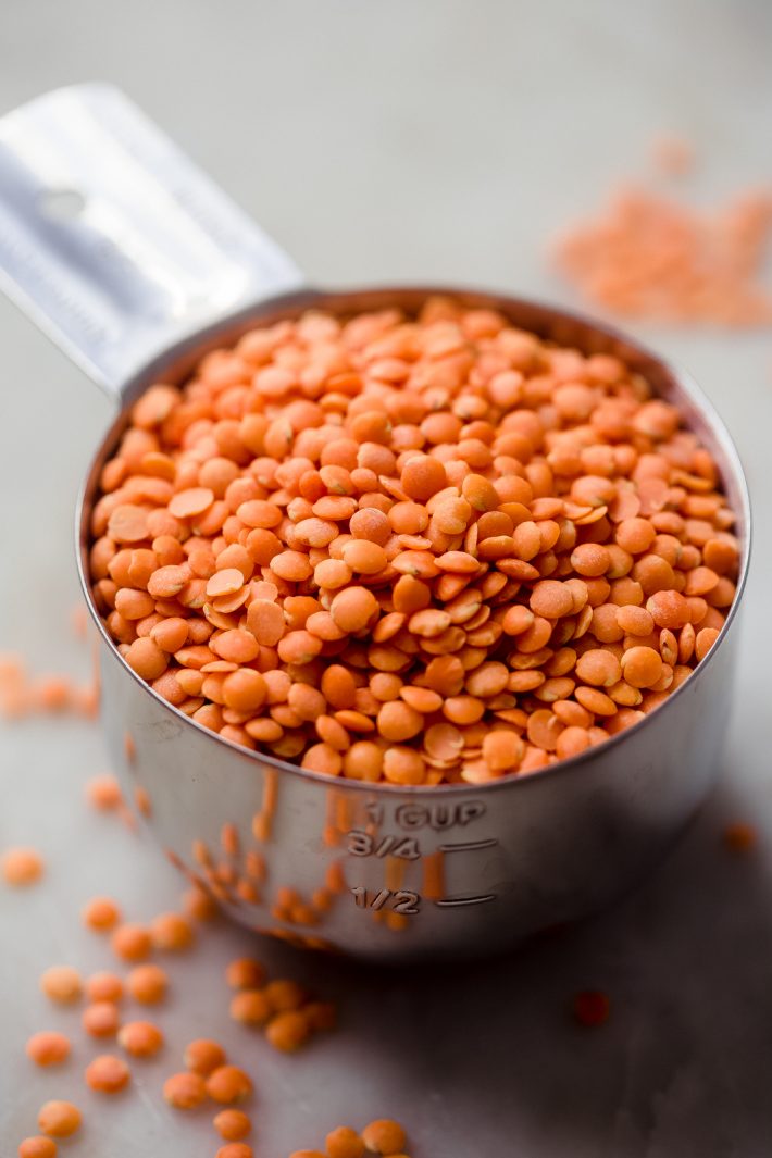 close of cup of red lentils 
