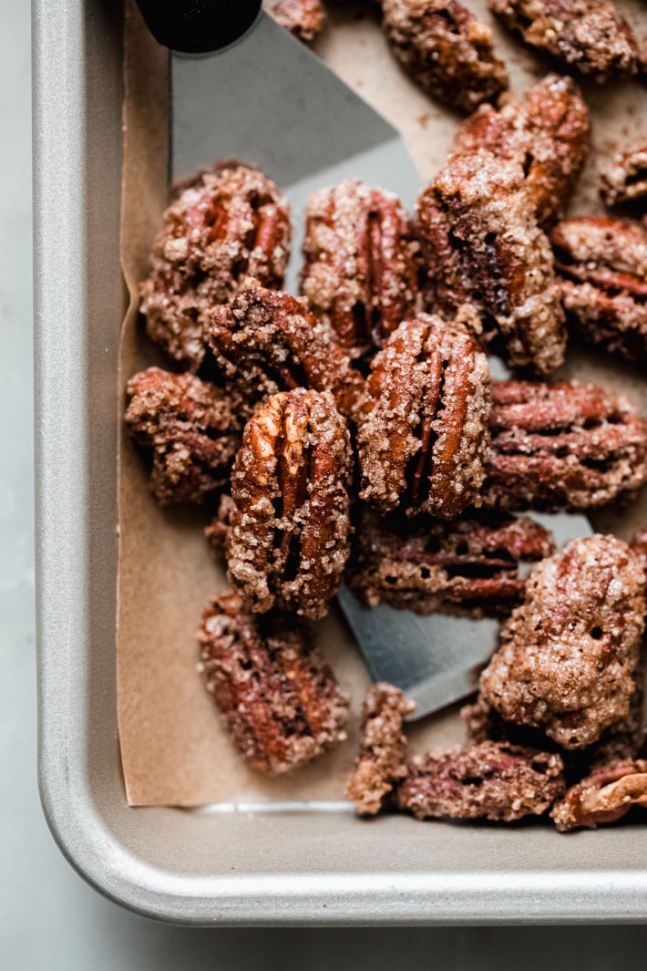 candied pecans on spatula