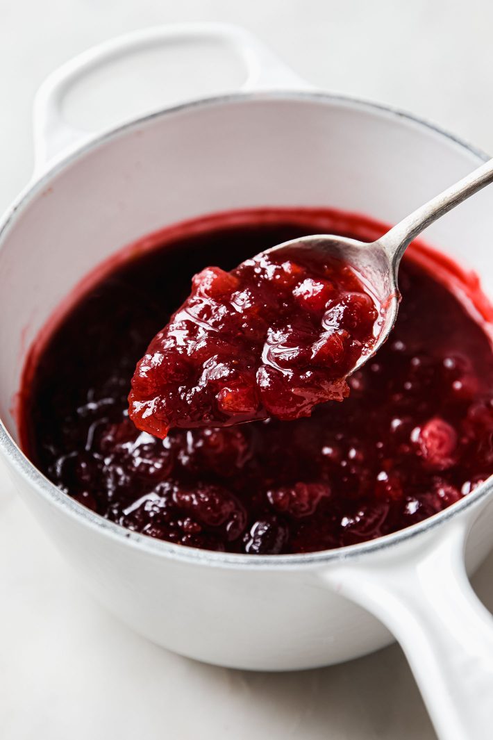 cranberry sauce on spoon from saucepan