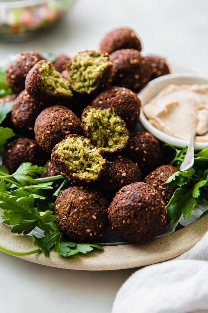 falafels on plate with parsley and hummus