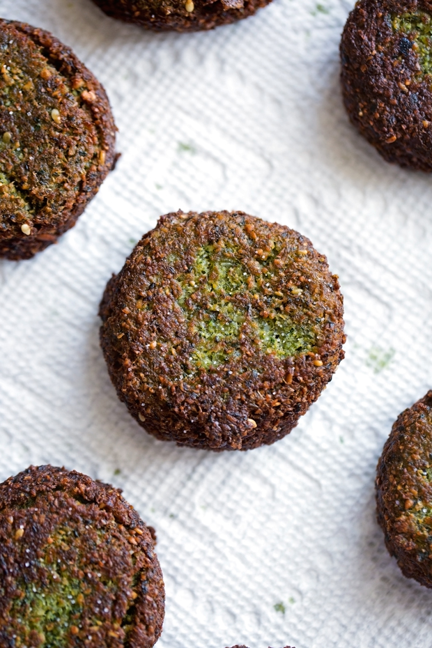 The Best Homemade Falafels - Traditional restaurant style falafels -- made at home! These tiny falafels are super easy to make at home and are loaded with traditional flavors like sesame seeds, tons of parsley and a hint of cumin. Stop paying for falafels when you can make them at home! #falafels #homemadefalafels #restaurantstylefalafels | Littlespicejar.com