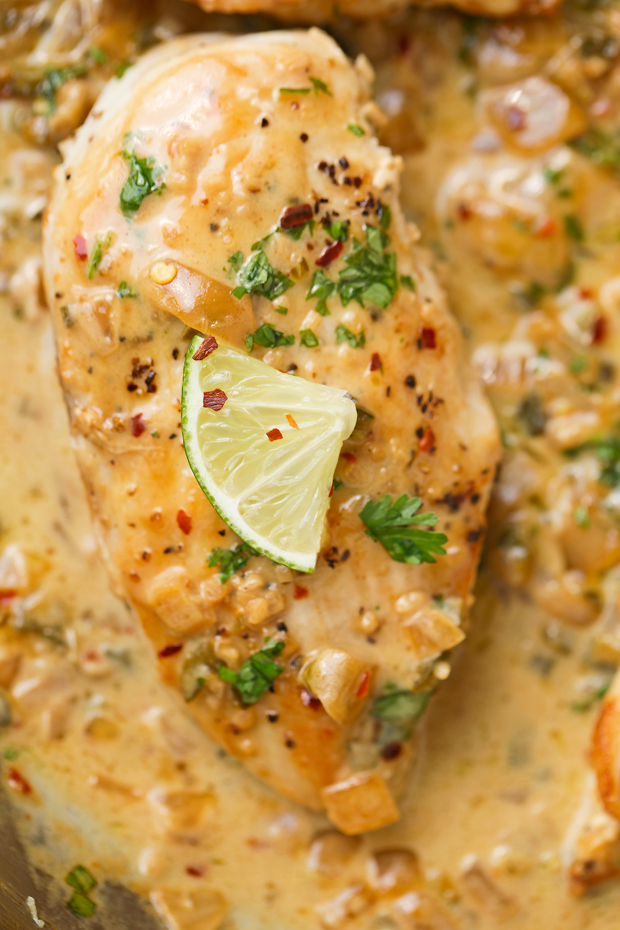 One Skillet Chicken with Fiesta Cream Sauce - a simple, 30 minutes, one skillet recipe topped with a cilantro, lime, jalapeño, and garlic flavored sauce. #oneskilletchicken #skilletchicken #chickendinner | Littlespicejar.com