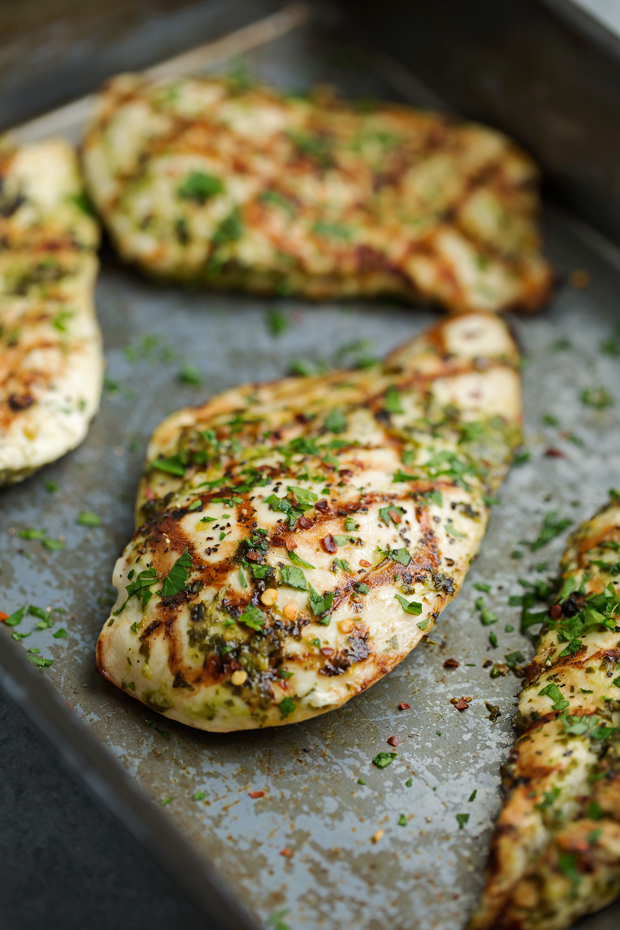 The Easiest Grilled Chimichurri Chicken - Chicken breasts marinated in homemade chimichurri sauce. This takes less than 5 minutes to prep and tastes AMAZING! #chimichurrichicken #grilledchicken #chickendinner | Littlespicejar.com