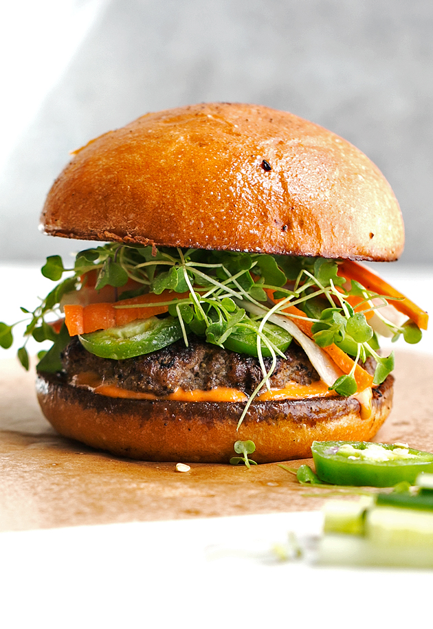 Banh Mi Burgers with Spicy Sriracha Mayo - Homemade burger patties that are juicy and tender topped with all your favorite banh mi fixings! #banhmi #banhmiburger #burgers #pickledveggies #grilling | Littlespicejar.com