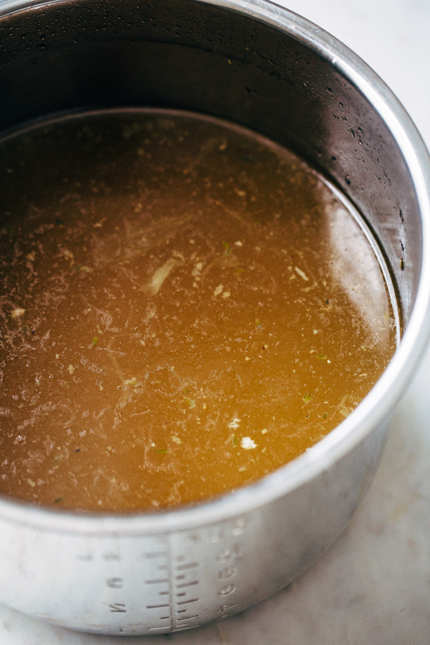 One hour pressure cooker chicken broth - Learn how to make chicken broth in a pressure cooker in 1 hour! This is a simple recipe that you can easily prepare and use in all your favorite dishes! #chickenbroth #bonebroth #pressurecooker #instantpot #instantpotchickenbroth | Littlespicejar.com